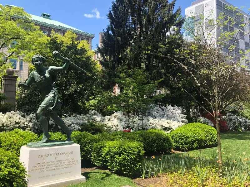 Barnard's green campus and the running woman statue